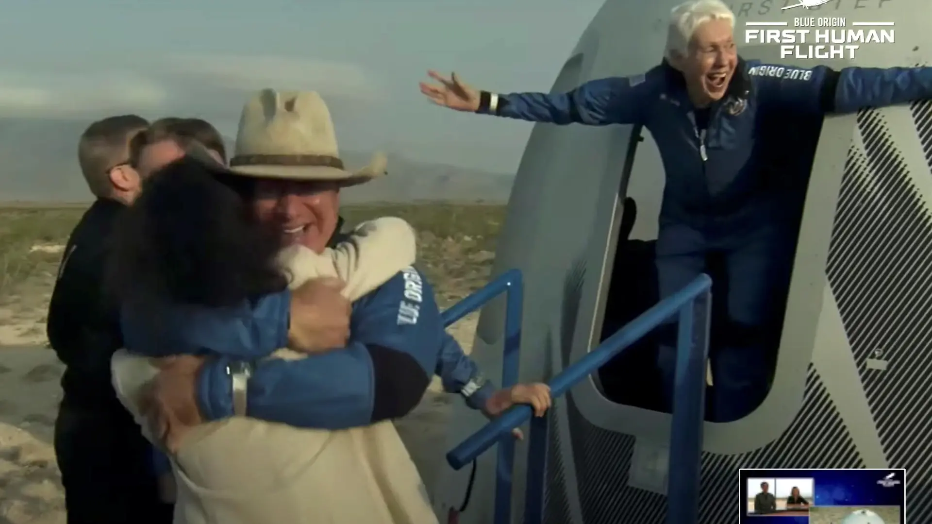 Billionaire businessman Jeff Bezos and pioneering female aviator Wally Funk emerge from their capsule after their flight aboard Blue Origin's New Shepard rocket on the world's first unpiloted suborbital flight near Van Horn, Texas, U.S., July 20, 2021 in a still image from video. Blue Origin/Handout via REUTERS. NO RESALES. NO ARCHIVES. THIS IMAGE HAS BEEN SUPPLIED BY A THIRD PARTY.