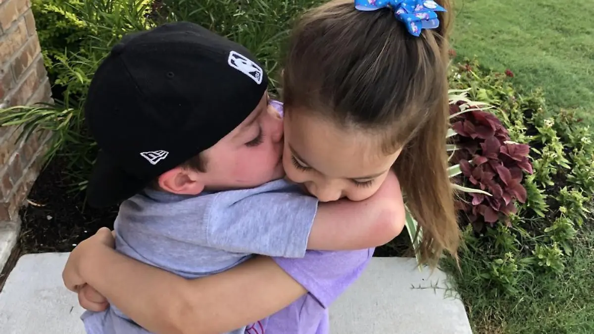 PIC FROM Kennedy News and Media (PICTURED: INSEPARABLE SIBLINGS FOUR-YEAR-OLD CANCER PATIENT BECKETT BURGE AND HIS SISTER AUBREY, FIVE, WHO HELPED HIM WHEN SICK, TAKEN IN 2019) A brave tot who went viral when a heart-breaking photo showed him being comforted by his four-year-old sister as he battled cancer has finally got the all clear - thanks to their 'irreplaceable bond'. Kaitlin Burge had previously shared heart-breaking images of little Beckett, then three, being comforted by his sister Aubrey, then four, as he was being sick over a toilet in 2019, during his battle with acute lymphoblastic leukaemia. The 30-year-old spoke of how little Aubrey, now seven, would rub his back, clean his face and wash his hands in a 'motherly figure' role in a bid to help Kaitlin and husband Matthew, 33. DISCLAIMER: While Kennedy News and Media uses its best endeavours to establish the copyright and authenticity of all pictures supplied, it accepts no liability for any damage, loss or legal action caused by the use of images supplied and the publication of images is solely at your discretion. SEE KENNEDY NEWS COPY - 0161 697 4266.