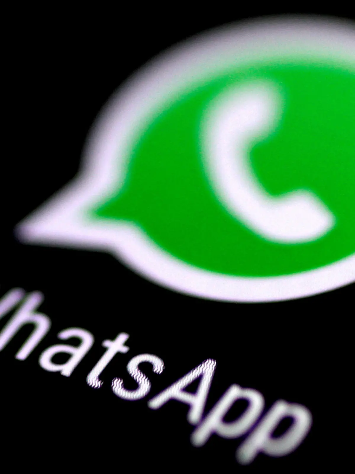FILE PHOTO: The WhatsApp messaging application is seen on a phone screen August 3, 2017.   REUTERS/Thomas White/File Photo