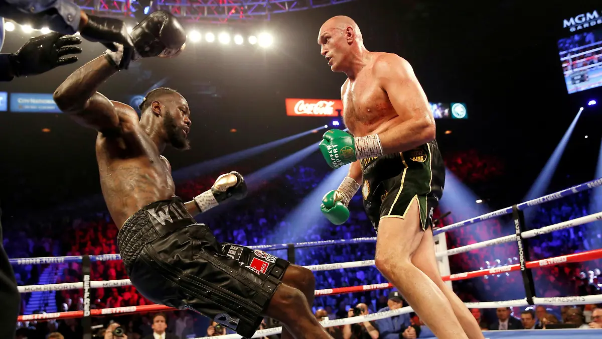 FILE PHOTO: Boxing - Deontay Wilder v Tyson Fury - WBC Heavyweight Title - The Grand Garden Arena at MGM Grand, Las Vegas, United States - February 22, 2020 Tyson Fury knocks down Deontay Wilder during the fight REUTERS/Steve Marcus/File Photo
