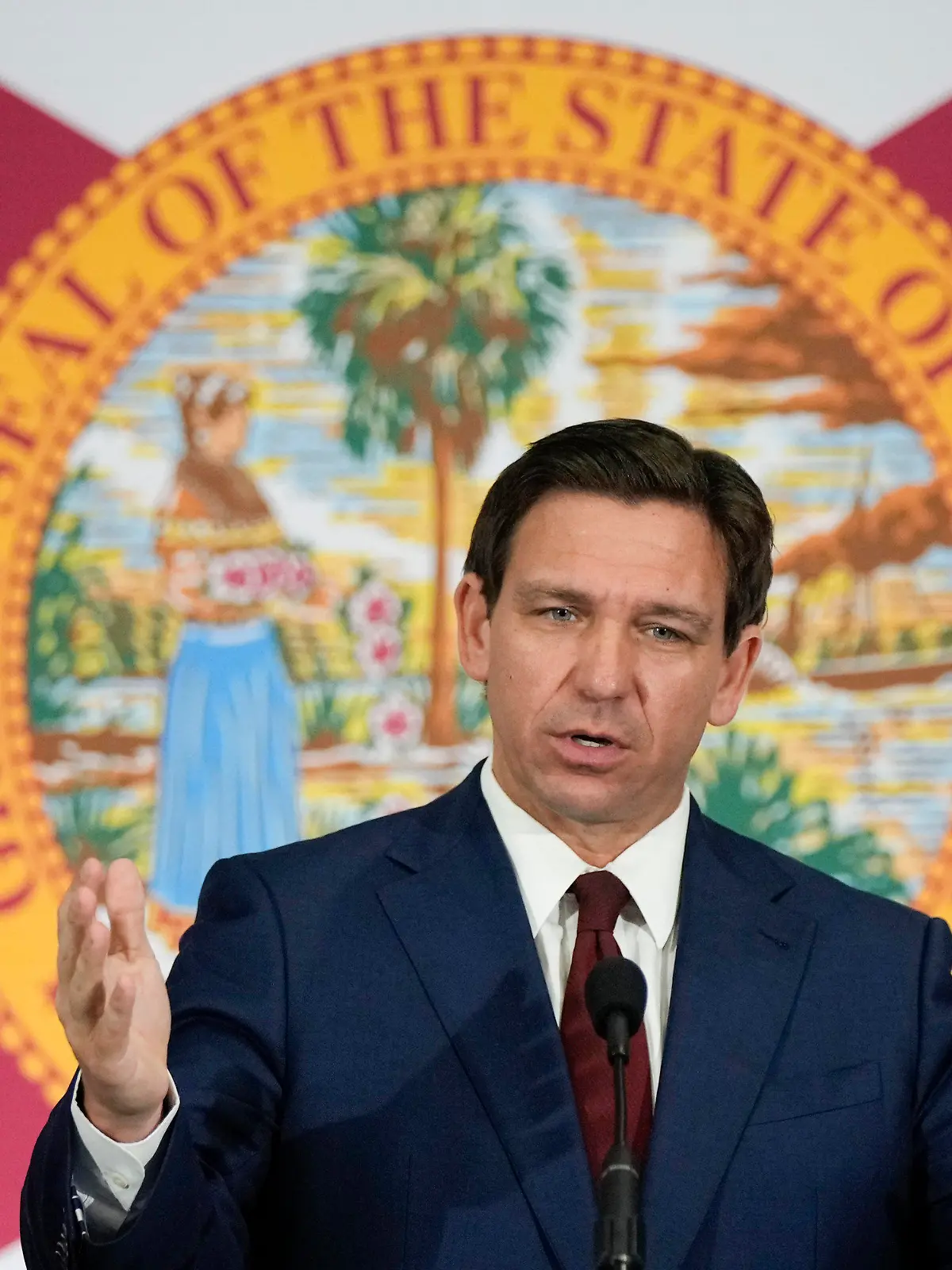 FILE - Florida Gov. Ron DeSantis speaks during a news conference in Miami, Tuesday, May 9, 2023. Videos circulating on social media purport to show empty Florida grocery stores due to a boycott of truck drivers over an immigration bill recently signed by DeSantis. However, while some truckers have threatened to stop deliveries in the state, these grocery aisles are empty for reasons that are unrelated to the recent bill. (AP Photo/Rebecca Blackwell, File)