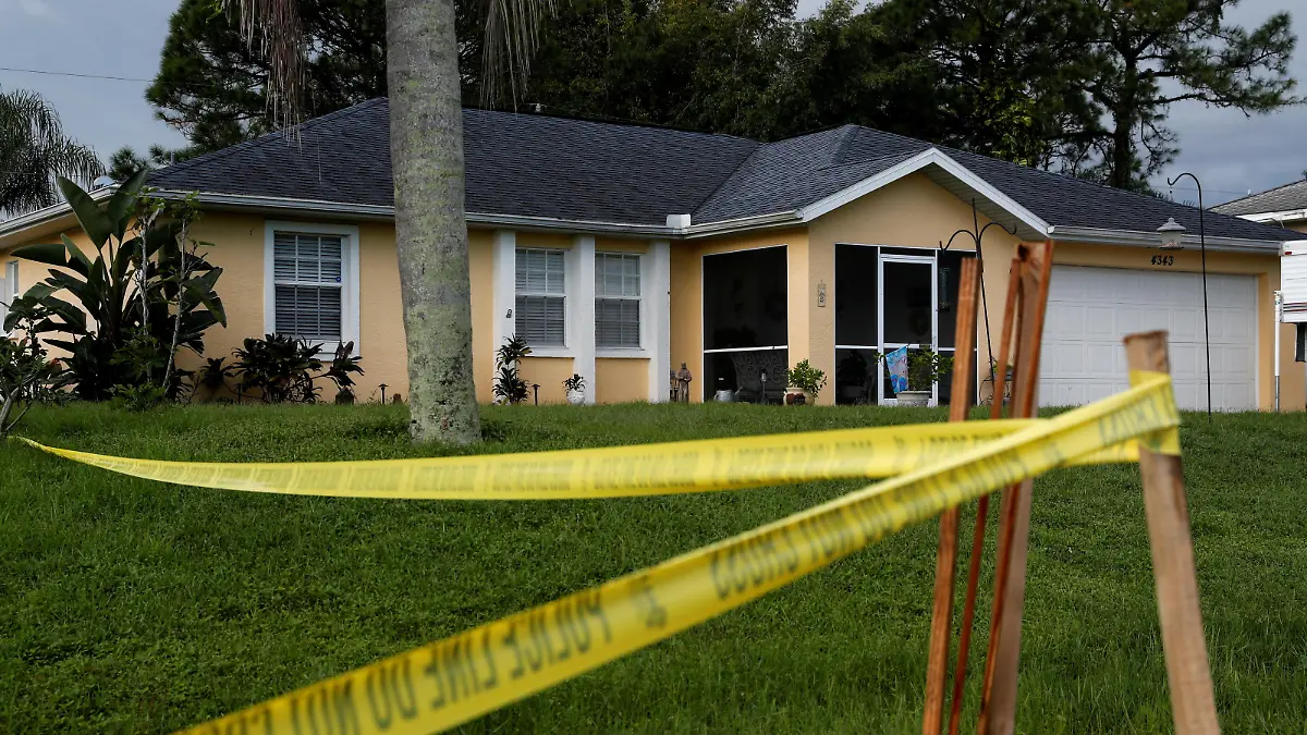 Police tape is seen outside the familiy home of Brian Laundrie, 23, a "person of interest" in the case of his fiancee Gabby Petito's body being found in a Wyoming national park, in North Port, Florida, U.S., September 22, 2021. REUTERS/Shannon Stapleton