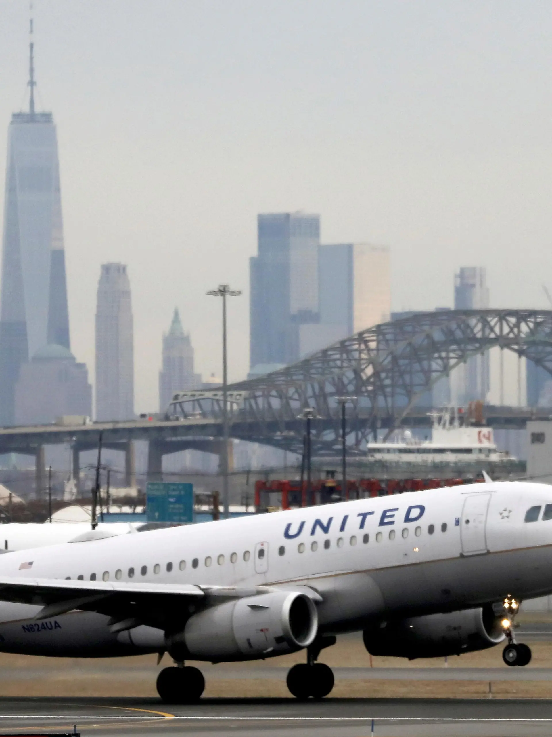 FILE PHOTO: A United Airlines passenger jet takes off with New York City as a backdrop, at Newark Liberty International Airport, New Jersey, U.S. December 6, 2019. REUTERS/Chris Helgren/File Photo