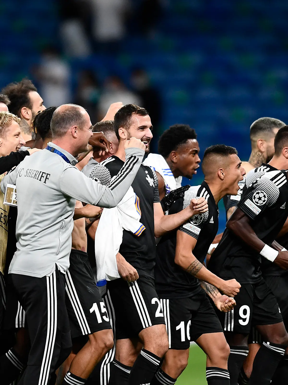 Sheriff's players celebrate at the end of the Champions League group D soccer match between Real Madrid and Sheriff, Tiraspol at the Bernabeu stadium in Madrid, Spain, Tuesday, Sept. 28, 2021. (AP Photo/Jose Breton)