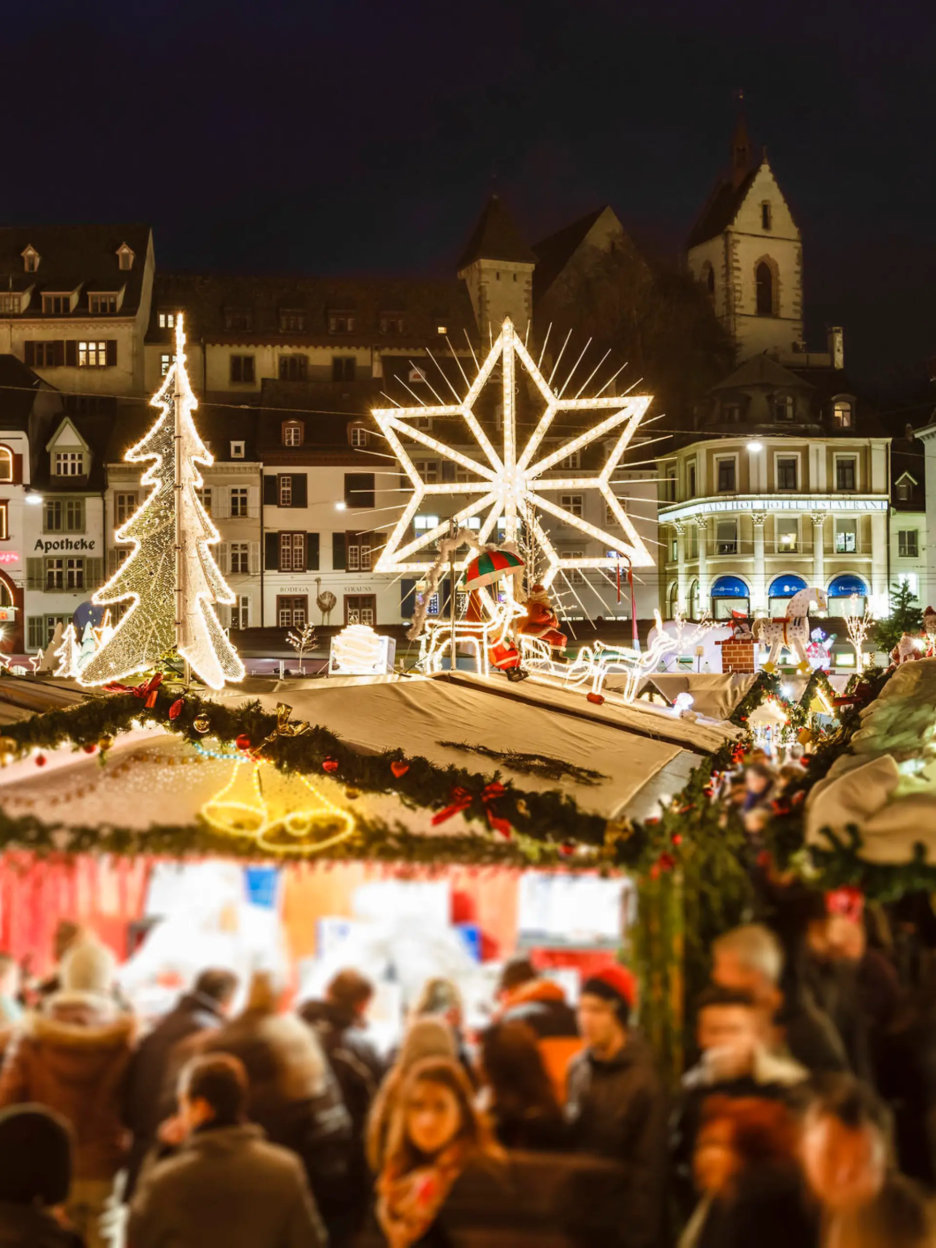 Christmas market in the old town of Basel, one of the largest and populated cities of Switzerland. It is located in the northwest of the country, on river Rhine and right on the Swiss-French-German border.
