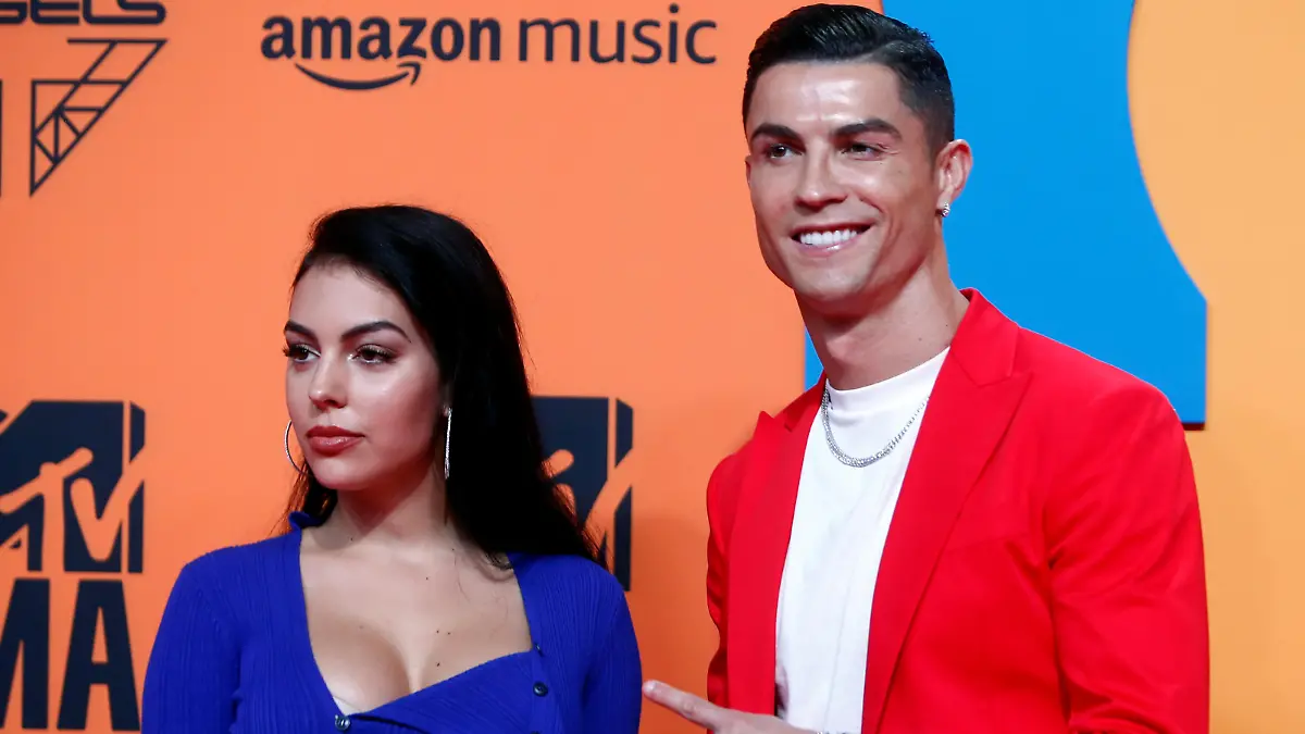 FILE PHOTO: Cristiano Ronaldo and Georgina Rodriguez pose on a red carpet as they arrive at the 2019 MTV Europe Music Awards at the FIBES Conference and Exhibition Centre in Seville, Spain, November 3, 2019. REUTERS/Jon Nazca/File Photo