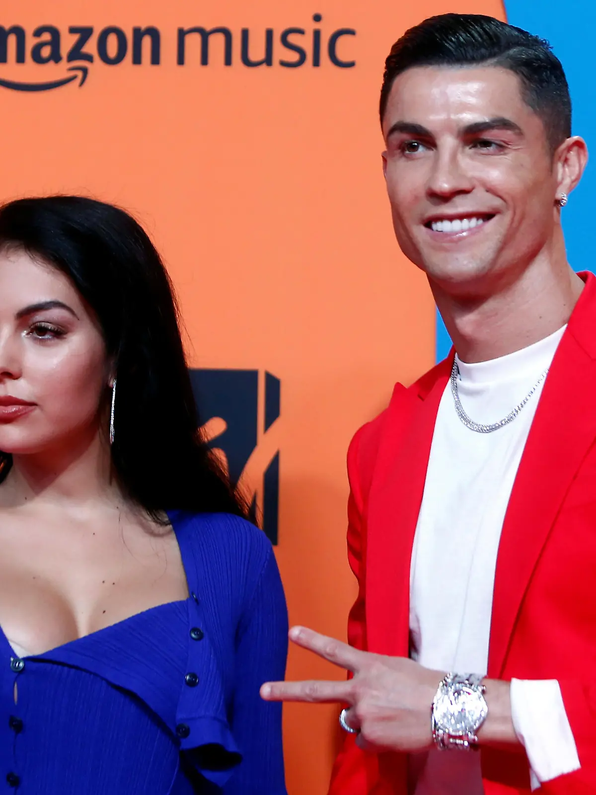 FILE PHOTO: Cristiano Ronaldo and Georgina Rodriguez pose on a red carpet as they arrive at the 2019 MTV Europe Music Awards at the FIBES Conference and Exhibition Centre in Seville, Spain, November 3, 2019. REUTERS/Jon Nazca/File Photo