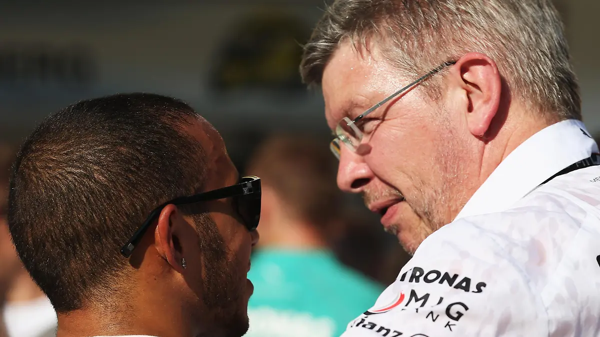 BUDAPEST, HUNGARY - JULY 28: Lewis Hamilton of Great Britain and Mercedes GP celebrates with Mercedes GP Team Principal Ross Brawn after winning the Hungarian Formula One Grand Prix at Hungaroring on July 28, 2013 in Budapest, Hungary. (Photo by Mark Thompson/Getty Images)