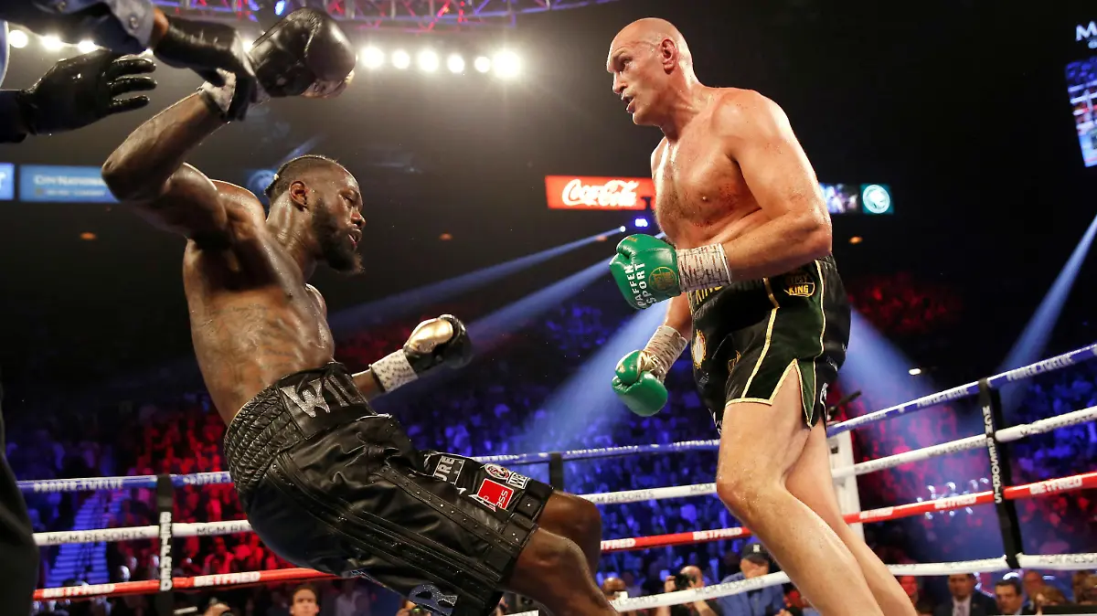Boxing - Deontay Wilder v Tyson Fury - WBC Heavyweight Title - The Grand Garden Arena at MGM Grand, Las Vegas, United States - February 22, 2020 Tyson Fury knocks down Deontay Wilder during the fight REUTERS/Steve Marcus TPX IMAGES OF THE DAY