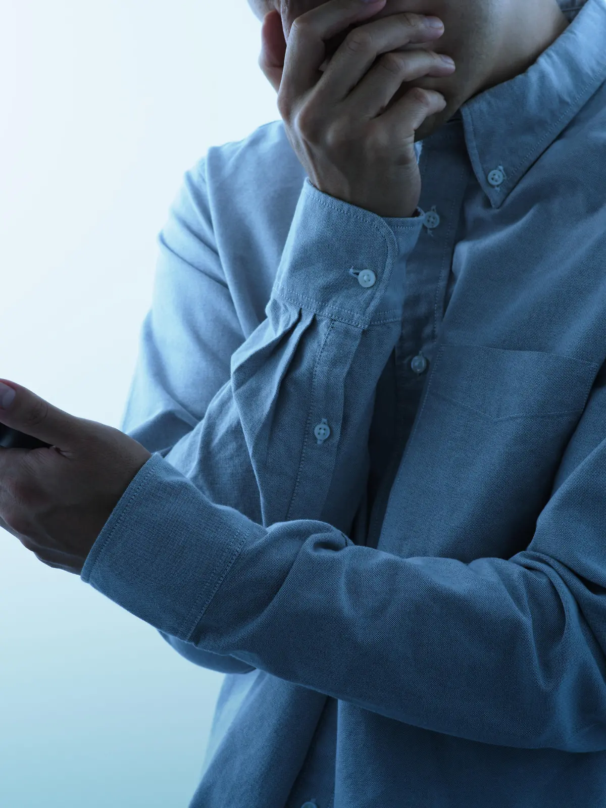 Man seeing smartphone with shocked look.