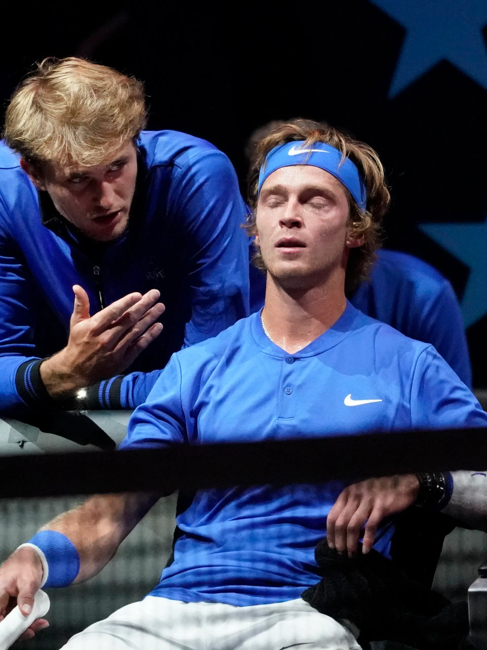 Team Europe's Alexander Zverev, of Germany, left, speaks to teammate Andrey Rublev, of Russia, during a break in his match against Team World's Diego Schwartzman, of Argentina, at Laver Cup tennis, Friday, Sept. 24, 2021, in Boston. (AP Photo/Elise Amendola)