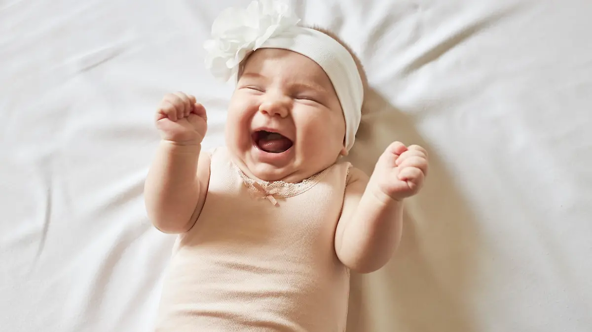 Cute little baby girl laughing