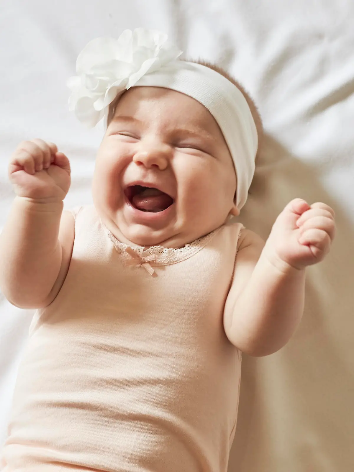 Cute little baby girl laughing