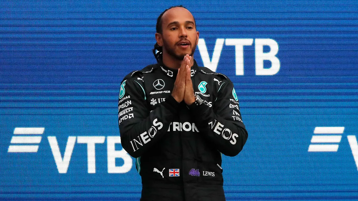 Formula One F1 - Russian Grand Prix - Sochi Autodrom, Sochi, Russia - September 26, 2021 Mercedes' Lewis Hamilton celebrates on the podium after winning the race REUTERS/Anton Vaganov