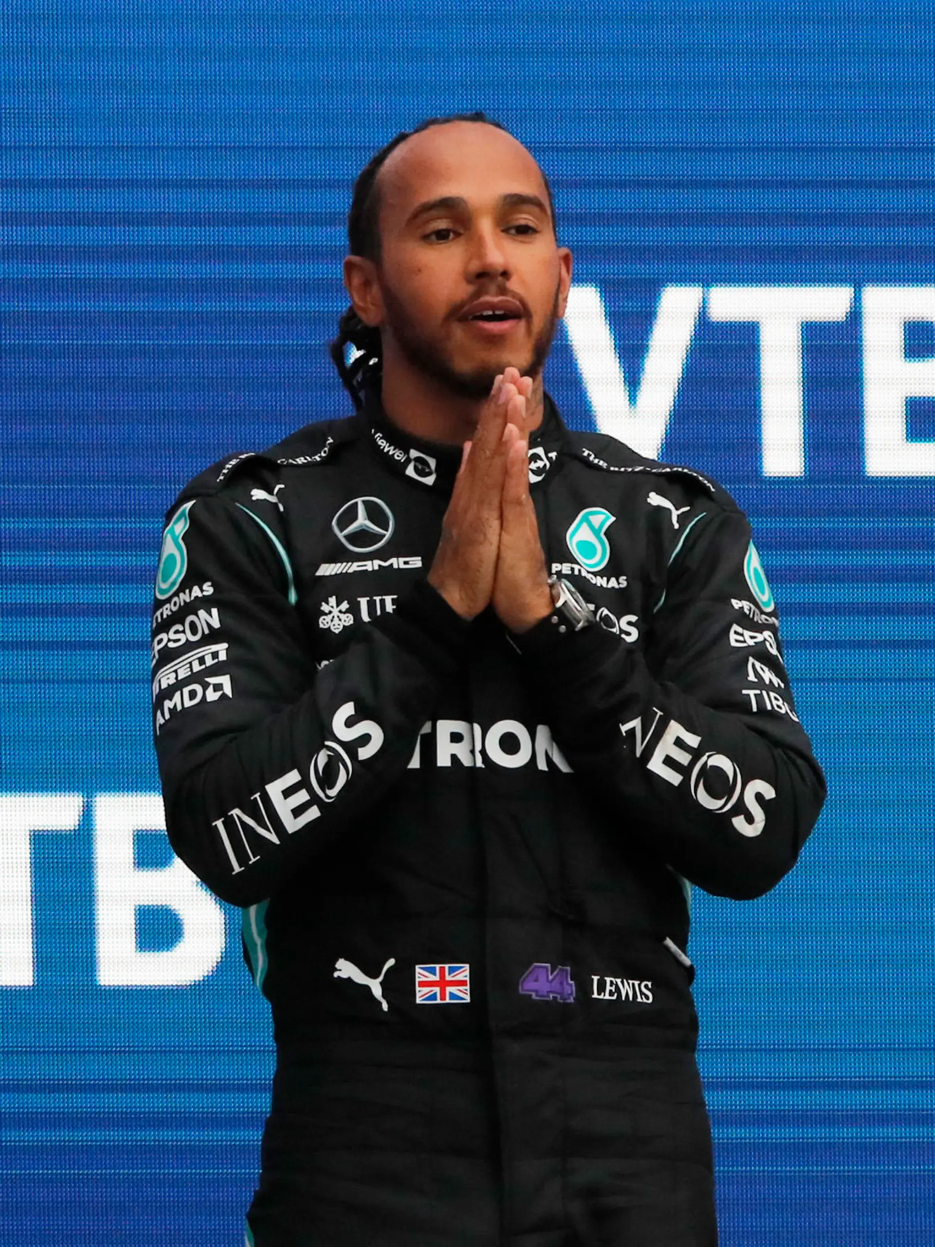 Formula One F1 - Russian Grand Prix - Sochi Autodrom, Sochi, Russia - September 26, 2021 Mercedes' Lewis Hamilton celebrates on the podium after winning the race REUTERS/Anton Vaganov