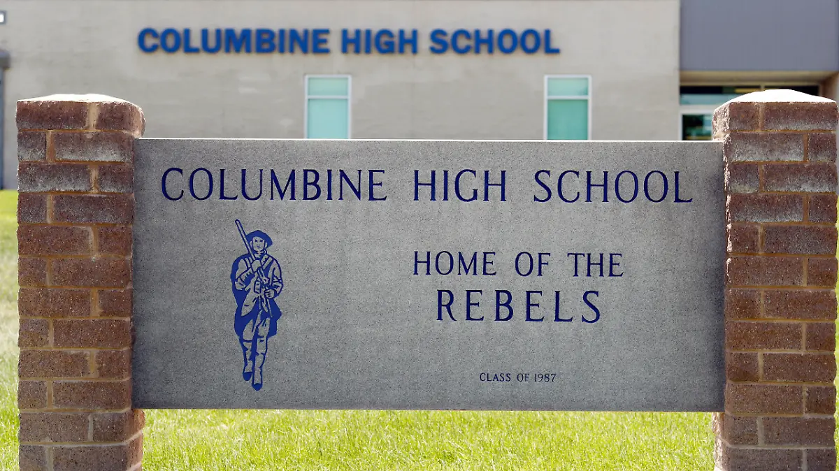 FILE - This June 13, 2019, file photo shows signs outside Columbine High School in Littleton, Colo. The Jefferson County School District has abandoned a proposal to demolish Columbine and replace it after a community survey showed strong opposition to the idea. (AP Photo/David Zalubowski, File)