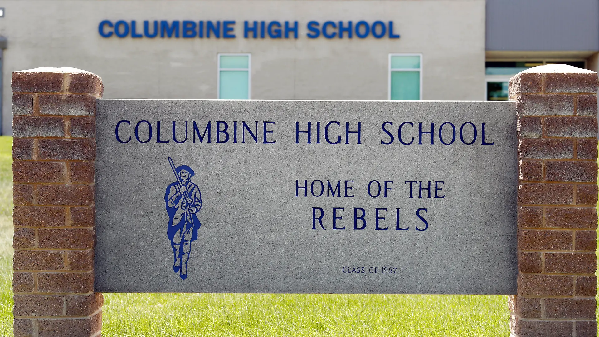 FILE - This June 13, 2019, file photo shows signs outside Columbine High School in Littleton, Colo. The Jefferson County School District has abandoned a proposal to demolish Columbine and replace it after a community survey showed strong opposition to the idea. (AP Photo/David Zalubowski, File)