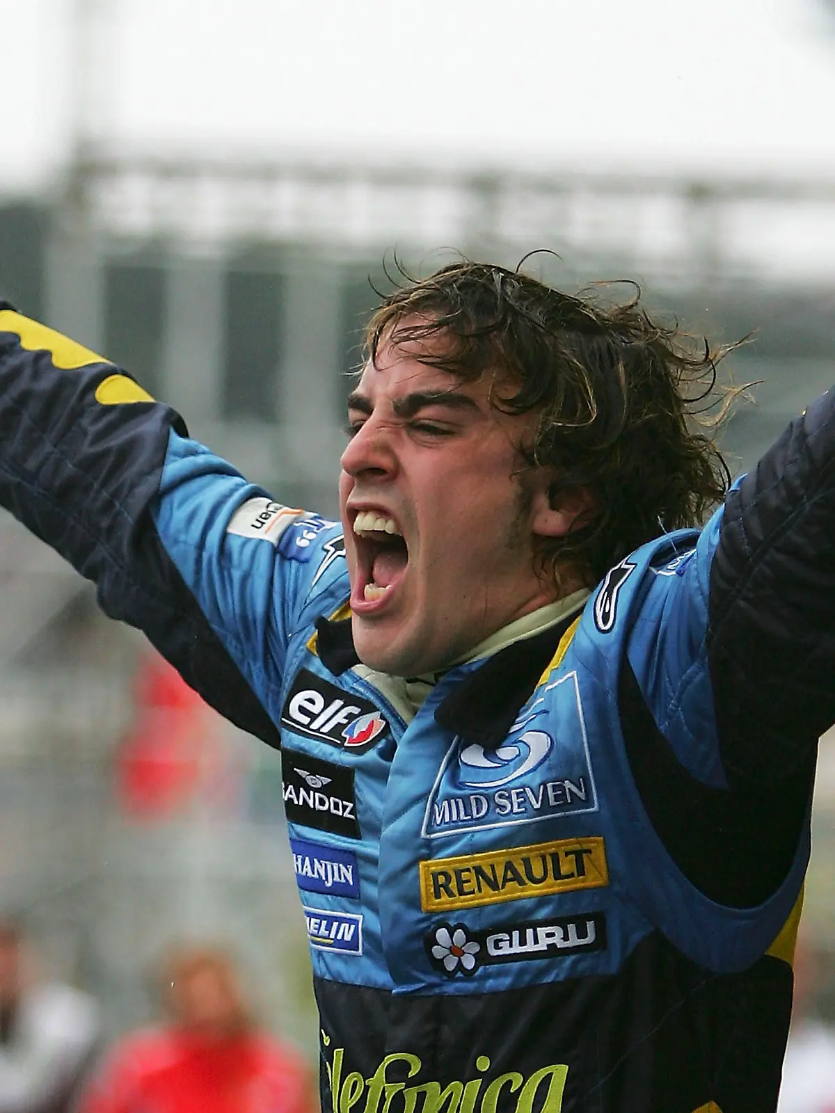 SAO PAULO, BRAZIL - SEPTEMBER 25:  Fernando Alonso of Spain and Renault celebrates winning the World Championship after finishing third in the Brazilian F1 Grand Prix at the Autodromo Interlagos on September 25, 2005 in Sao Paulo, Brazil.  (Photo by Clive Rose/Getty Images)