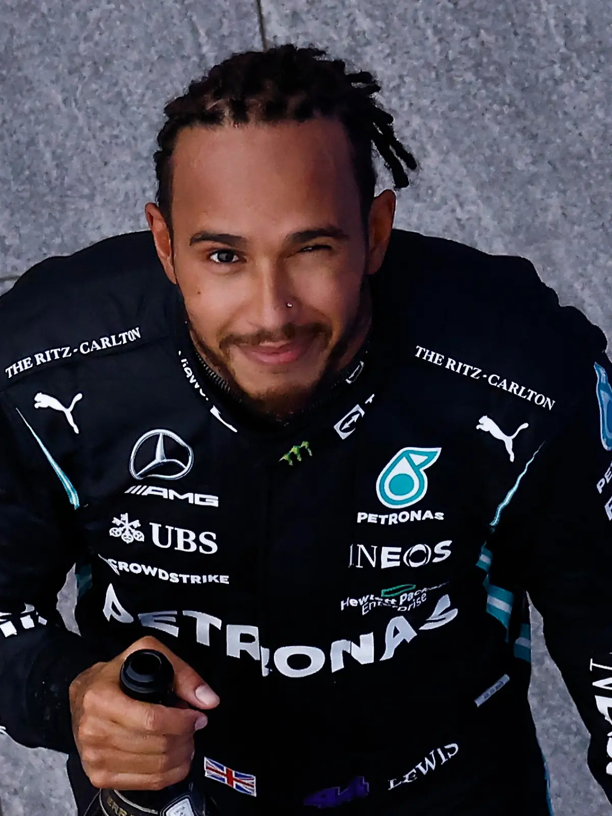 Formula One F1 - Russian Grand Prix - Sochi Autodrom, Sochi, Russia - September 26, 2021 Mercedes' Lewis Hamilton celebrates with champagne on the podium after winning the race Pool via REUTERS/Maxim Shemetov