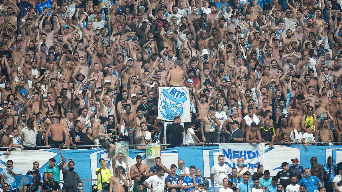 Soccer fans prior to the French League One soccer match between Marseille and Saint-Etienne at the Velodrome stadium in Marseille, southern France, Saturday, Aug. 28, 2021. (AP Photo/Daniel Cole)