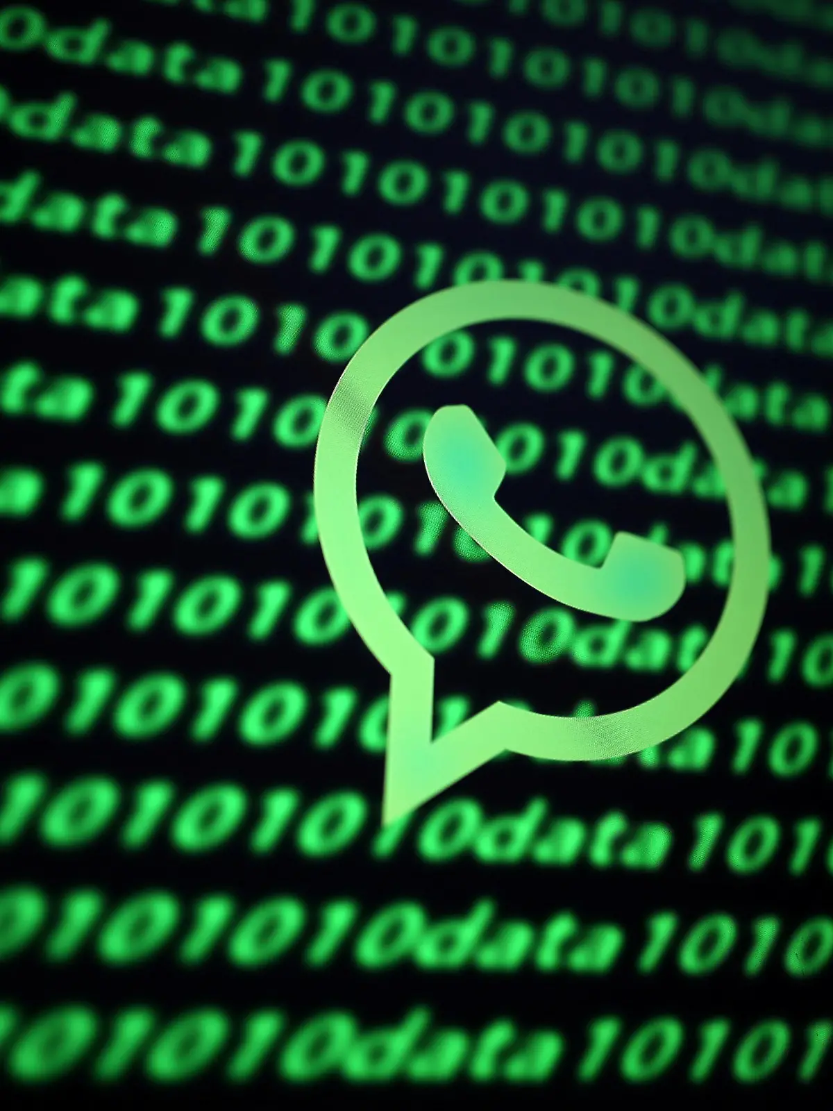 FILE PHOTO: The Whatsapp logo and binary cyber codes are seen in this illustration taken November 26, 2019. REUTERS/Dado Ruvic/Illustration/File Photo