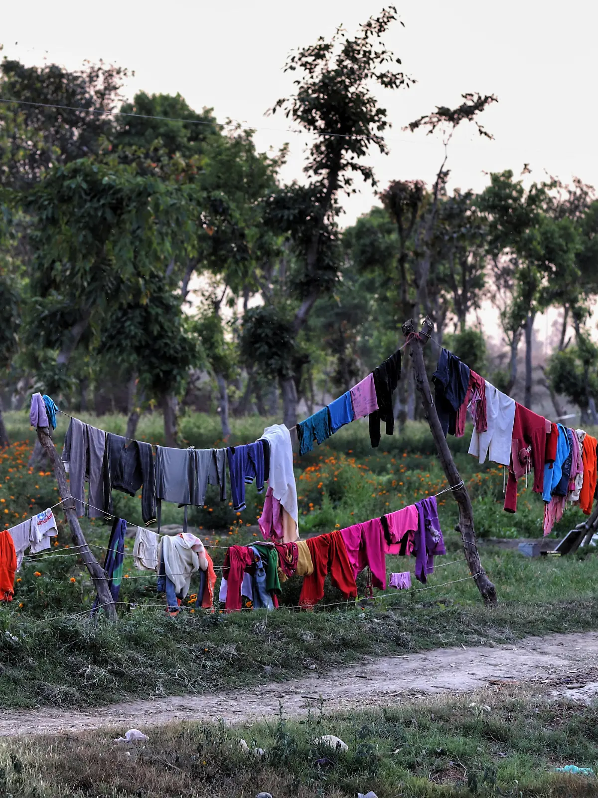 Clothes kept for drying in open in an agricultural Land on the outskirts of New Delhi, India on 20 March 2021 (Photo by Nasir Kachroo/NurPhoto)