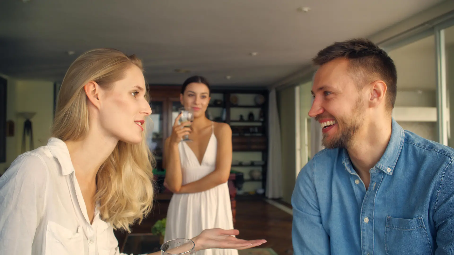 Man flirting with other woman in holiday villa