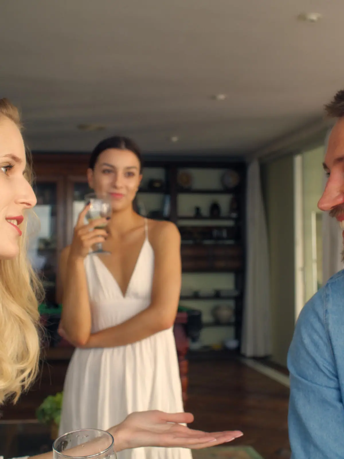 Man flirting with other woman in holiday villa