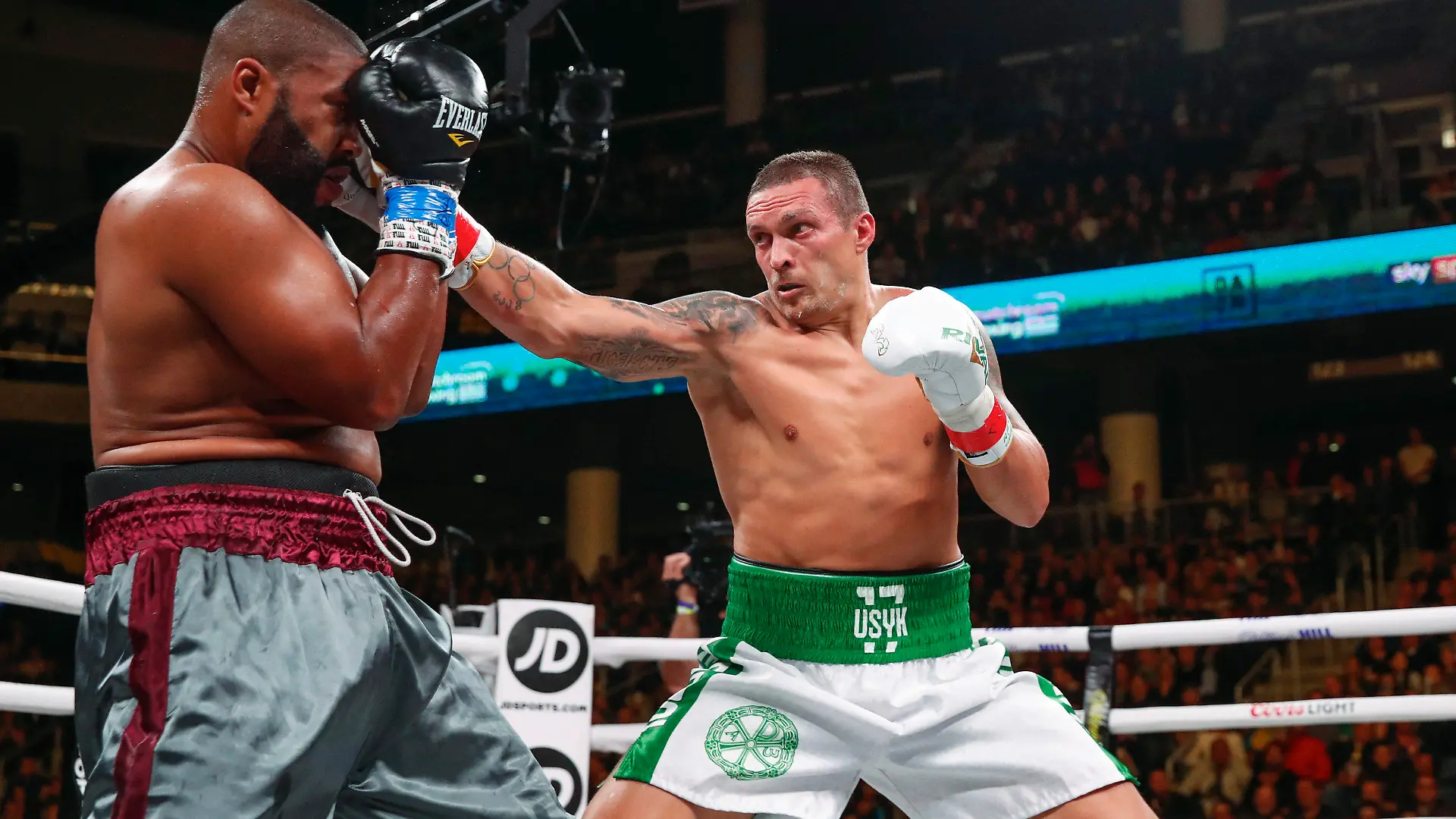 FILE - In this Saturday, Oct. 12, 2019 file photo, Oleksandr Usyk, right, hits Chazz Witherspoon during a heavyweight boxing bout, in Chicago. Usyk is scheduled to take on Anthony Joshua for the heavyweight title, at the London Tottenham Hotspur Stadium next Saturday, Sept. 25. (AP Photo/Kamil Krzaczynski, File)