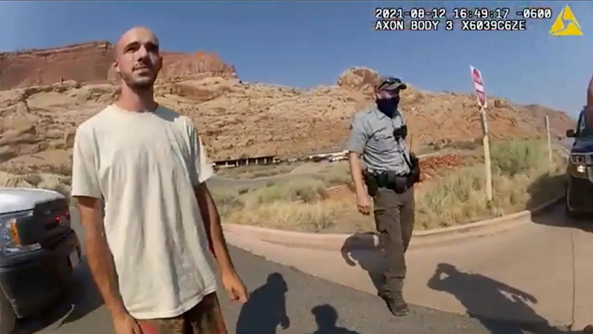 This police camera video provided by The Moab Police Department shows Brian Laundrie  talking to a police officer after police pulled over the van he was traveling in with his girlfriend, Gabrielle “Gabby” Petito, near the entrance to Arches National Park on Aug. 12, 2021. The couple was pulled over while they were having an emotional fight. Petito was reported missing by her family a month later and is now the subject of a nationwide search. (The Moab Police Department via AP)