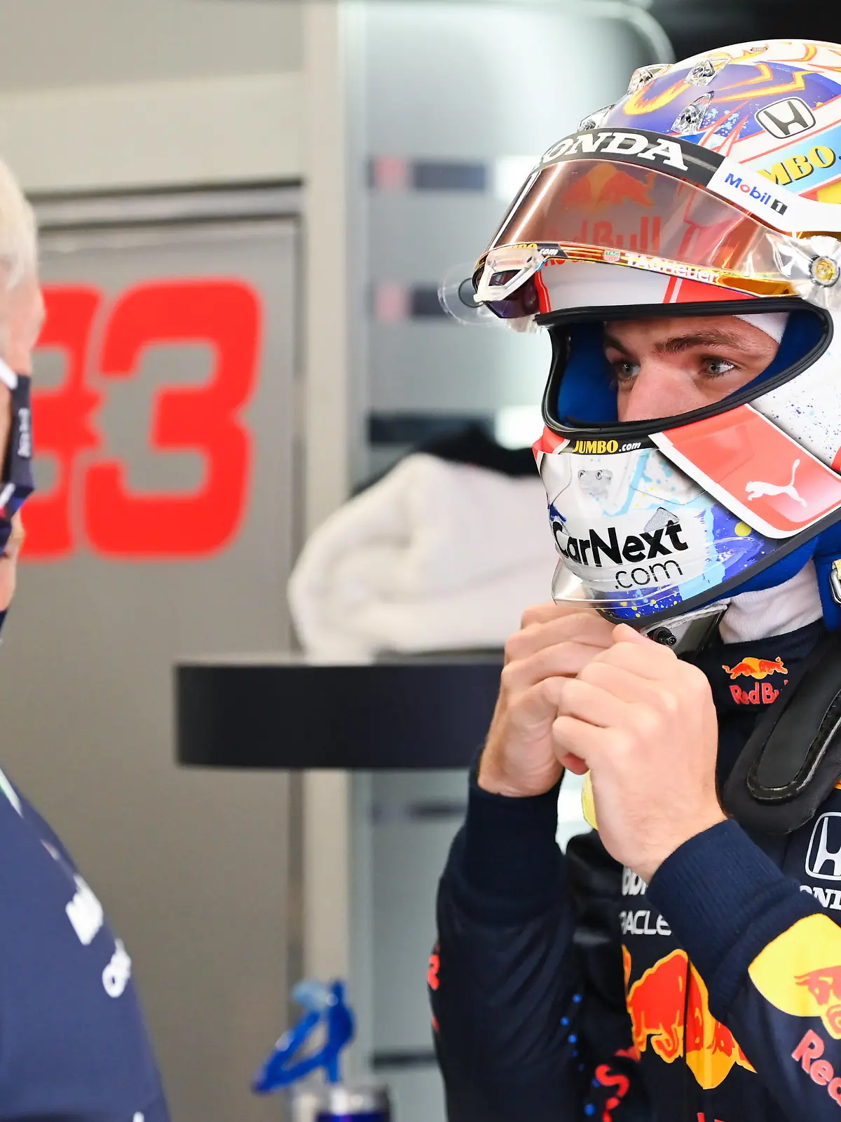 ZANDVOORT, NETHERLANDS - SEPTEMBER 03: Max Verstappen of Netherlands and Red Bull Racing talks with Red Bull Racing Team Consultant Dr Helmut Marko in the garage during practice ahead of the F1 Grand Prix of The Netherlands at Circuit Zandvoort on September 03, 2021 in Zandvoort, Netherlands. (Photo by Dan Mullan/Getty Images)