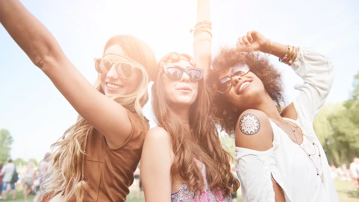 Three best friends at the music festival