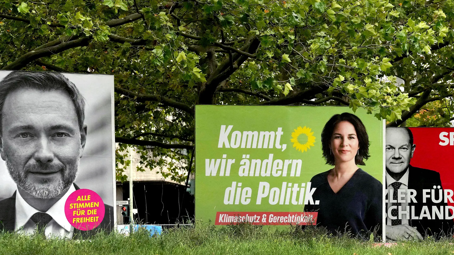 Four elections posters show top candidate of the German Liberals Christian Lindner, left, top candidate for chancellor of the Greens Annalena Baerbock, second left, Social Democratic top candidate for chancellor Olaf Scholz, second right, and Christian Democratic top candidate for chancellor Armin Laschet, right, in Berlin, Germany, Thursday, Sept. 16, 2021. German federal elections will be on Sept. 26, 2021. (AP Photo/Michael Sohn)
