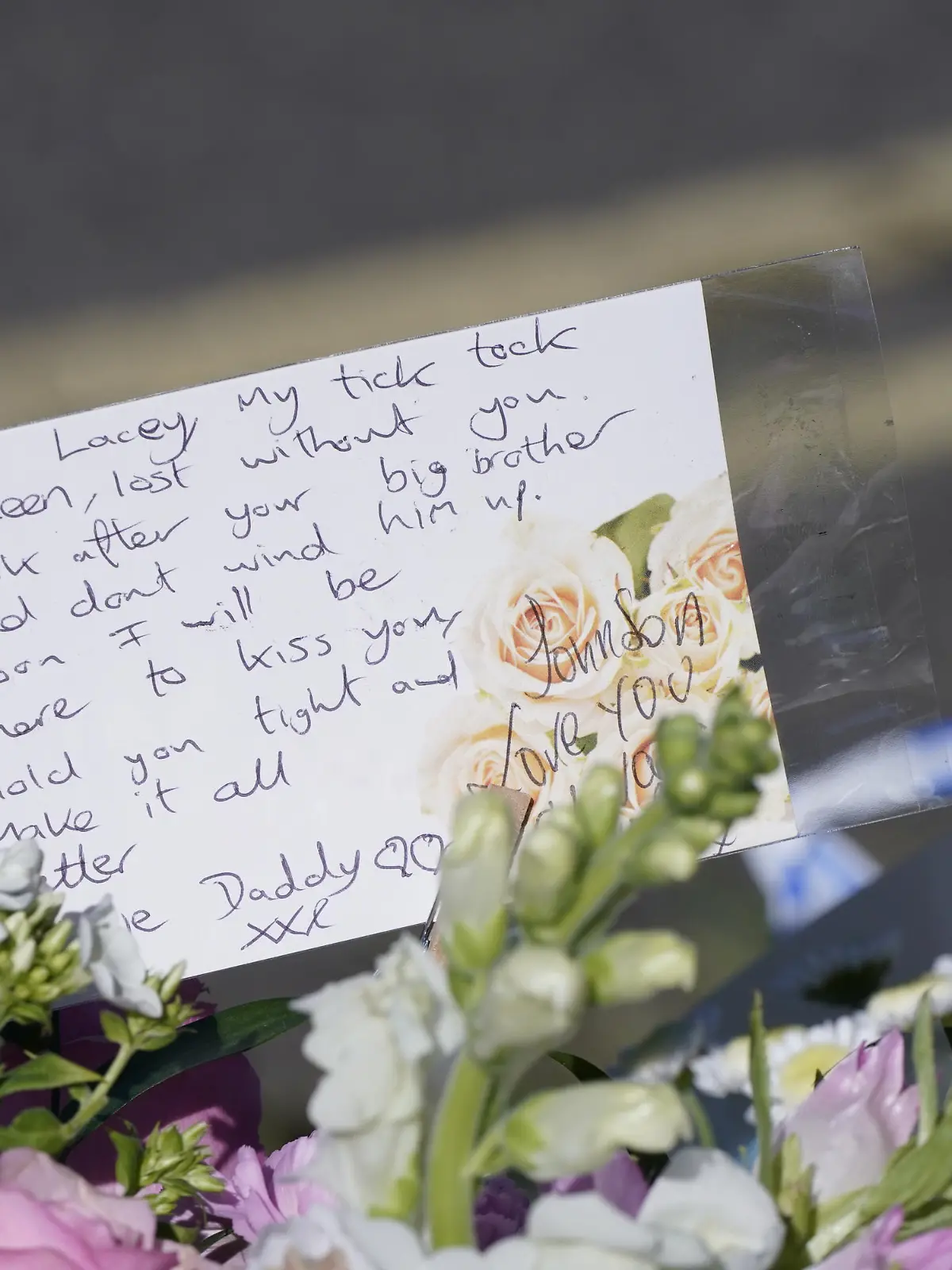 Killamarsh deaths. Messages left by the father to one of the victims on bouquets of flowers at the scene in Chandos Crescent, Killamarsh, near Sheffield, where four people were found dead at a house on Sunday. Derbyshire Police said a man is in police custody and they are not looking for anyone else in connection with the deaths. Picture date: Monday September 20, 2021. See PA story POLICE Killamarsh. Photo credit should read: Danny Lawson/PA Wire URN:62547229