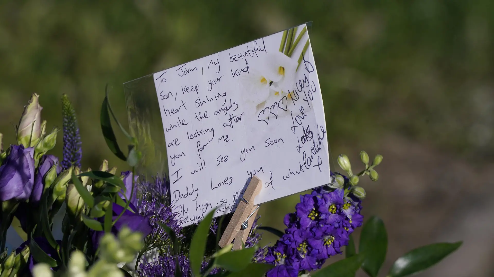 Killamarsh deaths. Messages left by the father to one of the victims on bouquets of flowers at the scene in Chandos Crescent, Killamarsh, near Sheffield, where four people were found dead at a house on Sunday. Derbyshire Police said a man is in police custody and they are not looking for anyone else in connection with the deaths. Picture date: Monday September 20, 2021. See PA story POLICE Killamarsh. Photo credit should read: Danny Lawson/PA Wire URN:62547230
