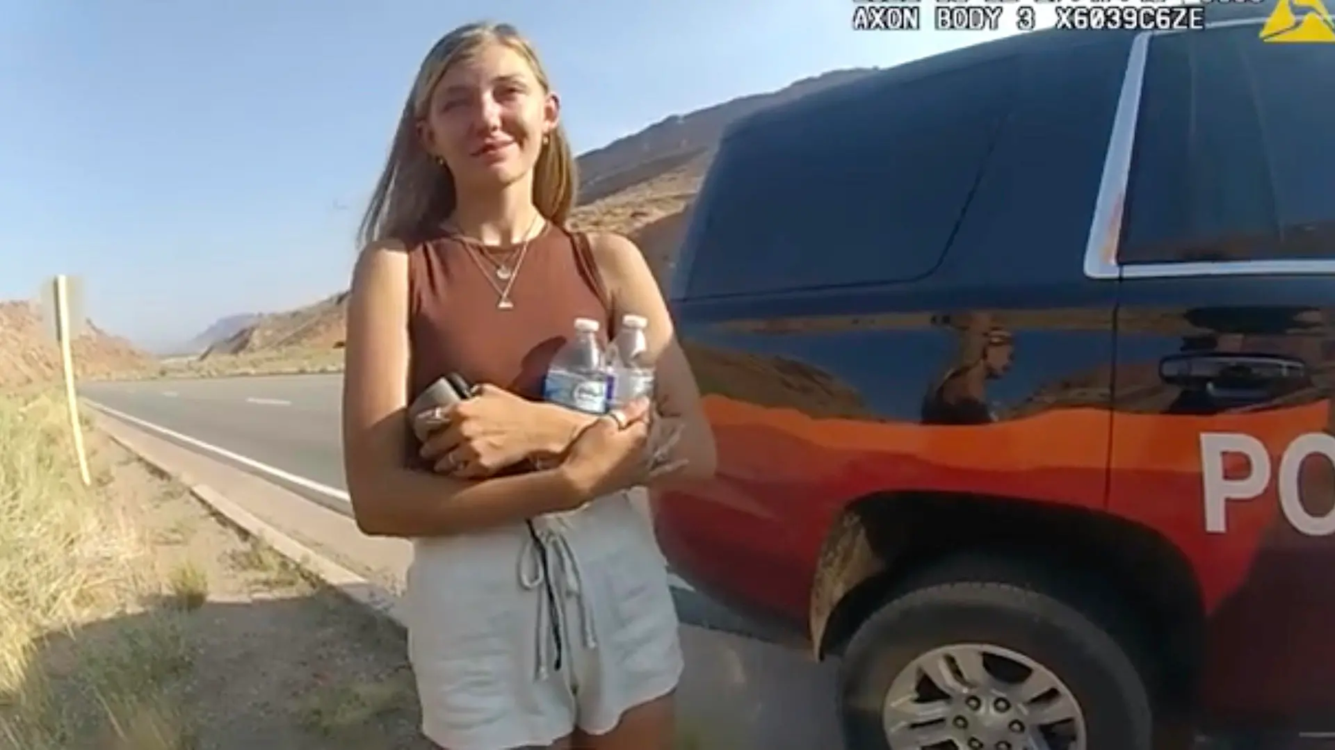 This police camera video provided by The Moab Police Department shows Gabrielle “Gabby” Petito talking to a police officer after police pulled over the van she was traveling in with her boyfriend, Brian Laundrie, near the entrance to Arches National Park on Aug. 12, 2021. The couple was pulled over while they were having an emotional fight. Petito was reported missing by her family a month later and is now the subject of a nationwide search. (The Moab Police Department via AP)