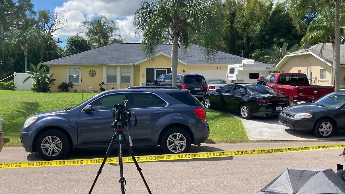 Law enforcement officials swarmed a home in North Port, Fla. on Monday, Sept. 20, 2021, in the disappearance of Gabby Petito, whose body was apparently discovered over the weekend at a Wyoming national park. The officers served a search warrant at the home of the parents of her 23-year-old boyfriend Brian Laundrie, who is wanted for questioning. (AP Photo/Curt Anderson)