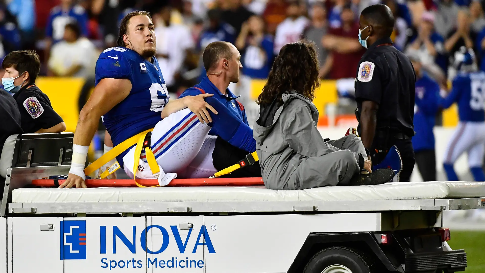 Sep 16, 2021; Landover, Maryland, USA; New York Giants center Nick Gates (65) reacts after suffering an apparent leg injury against the Washington Football Team during the first half at FedExField. Mandatory Credit: Brad Mills-USA TODAY Sports