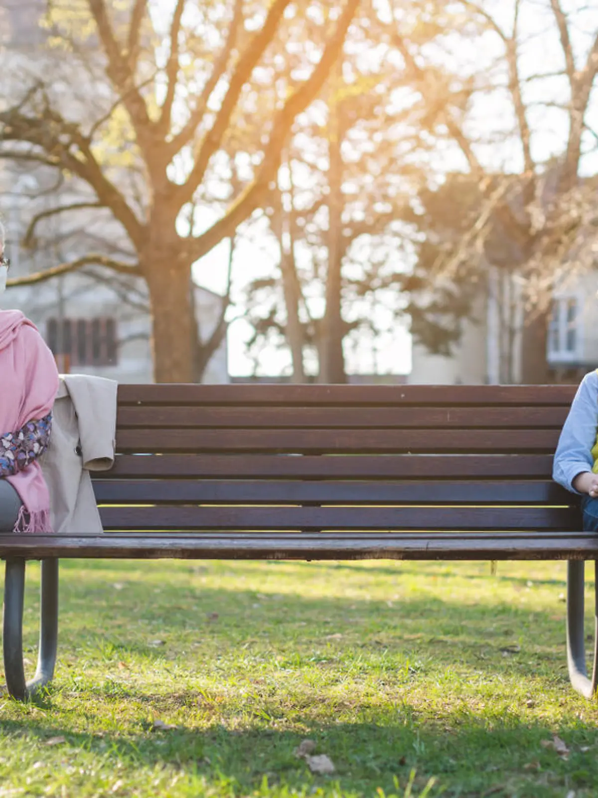 Grandmother and grandson separated by social distancing