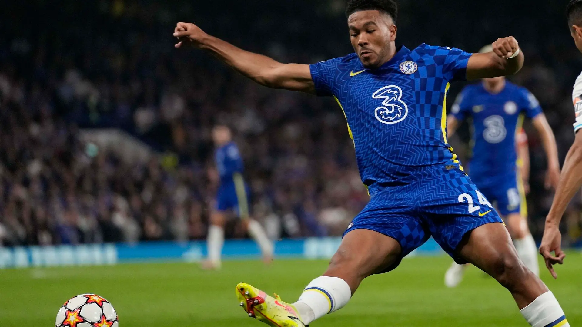 Chelsea's Reece James, left, challenges for the ball with Zenit's Douglas Santos during the Champions League Group H soccer match between Chelsea and Zenit St Petersburg at Stamford Bridge stadium in London Tuesday, Sept. 14, 2021. (AP Photo/Kirsty Wigglesworth)