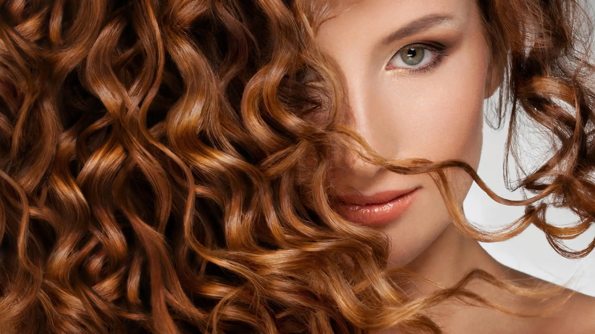Beautiful young woman with long curly hairs