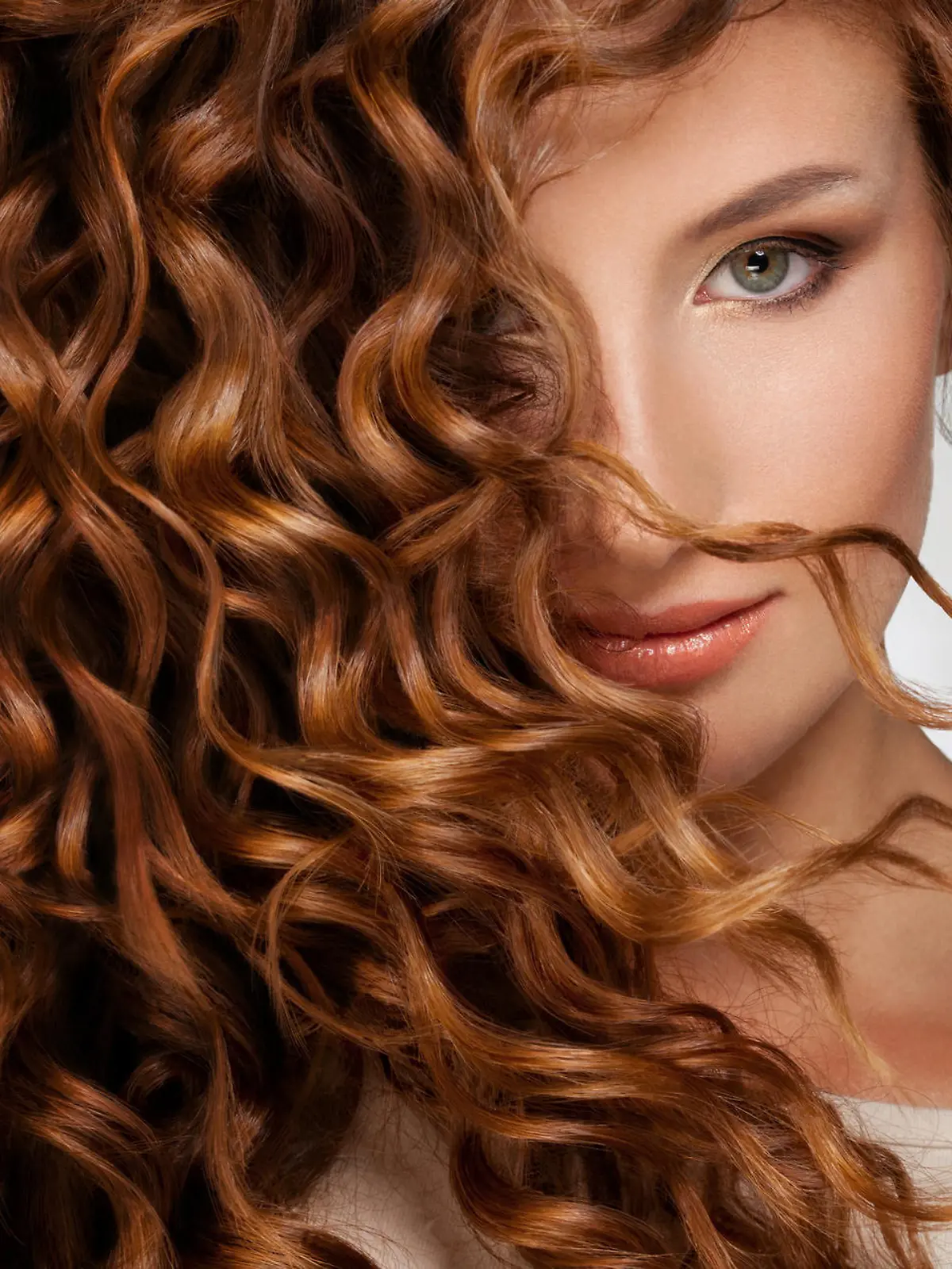 Beautiful young woman with long curly hairs