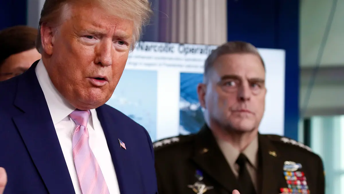 President Donald Trump speaks about the coronavirus in the James Brady Press Briefing Room of the White House, Wednesday, April 1, 2020, in Washington, as Chairman of the Joint Chiefs Gen. Mark Milley, listens. (AP Photo/Alex Brandon)