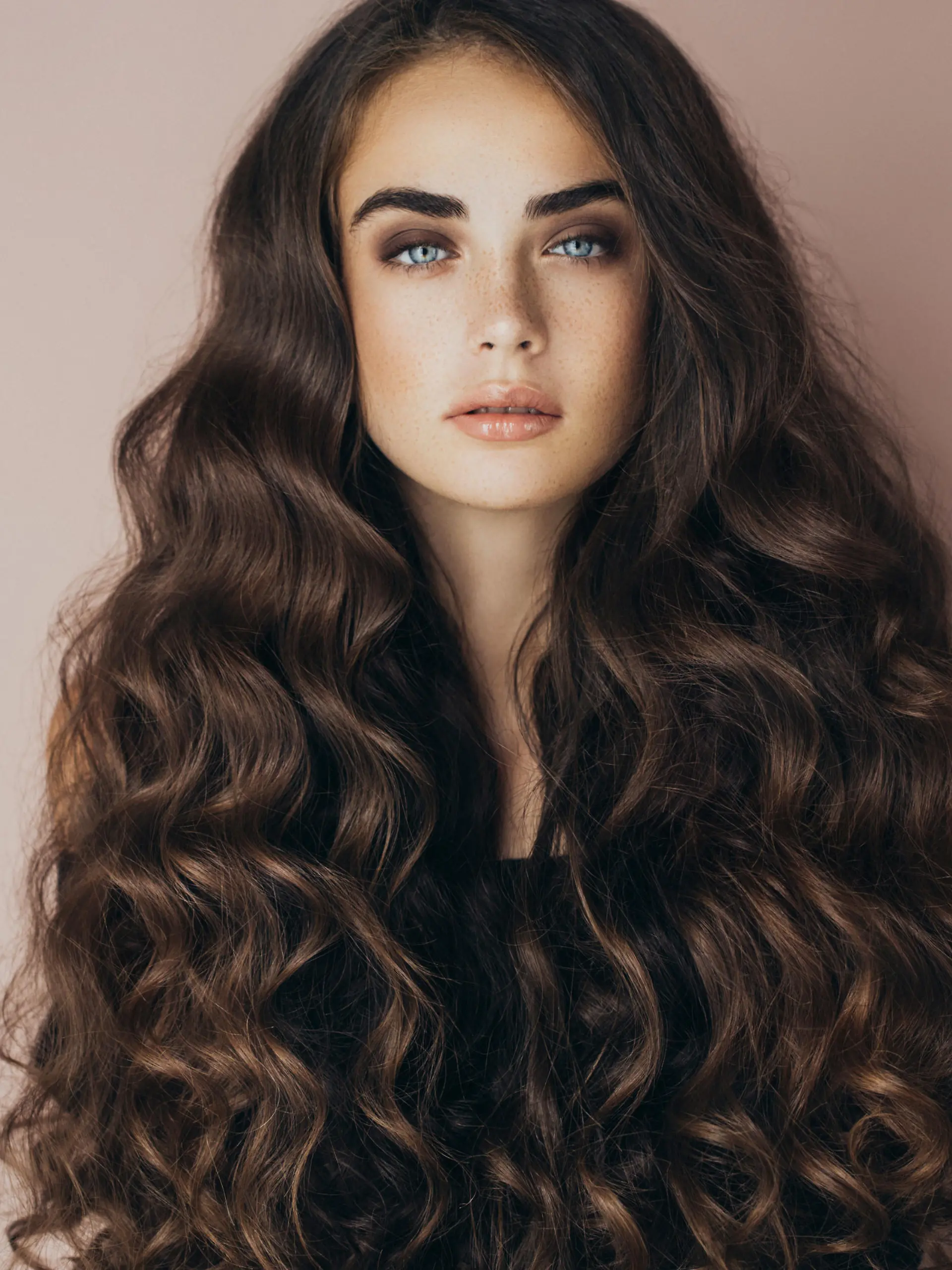 Studio shot of young beautiful woman. Professional make-up and hairstyle.