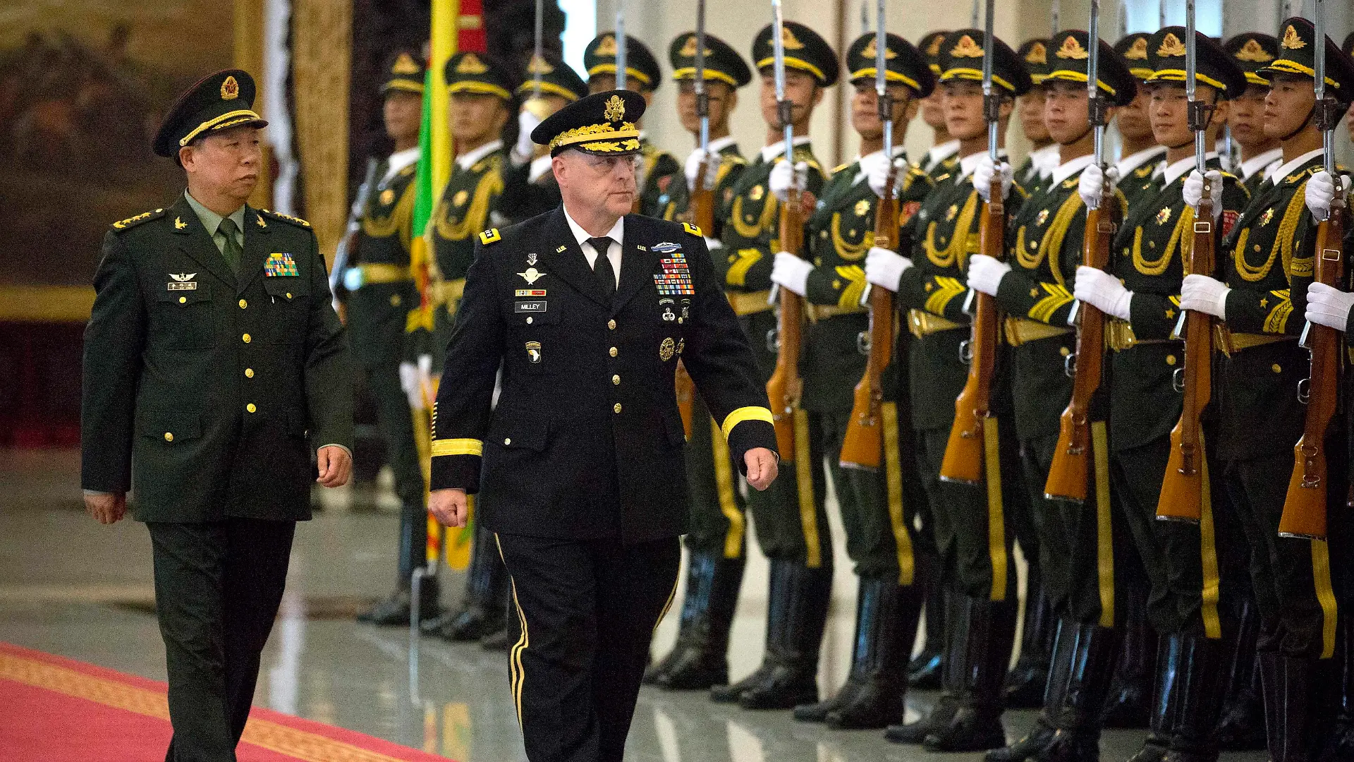 epa05489113 U.S. Army Chief of Staff General Mark Milley (C) is accompanied by China's People's Liberation Army (PLA) General Li Zuocheng (L) as they inspect a guard of honor during a welcome ceremony at the Bayi Building in Beijing, 16 August 2016. The 39th U.S. Army Chief of Staff is visiting the Asia-Pacific region, including China, South Korea, Japan and Hawaii from 15 to 23 August, according to an U.S. Army press release. EPA/MARK SCHIEFELBEIN / POOL ++