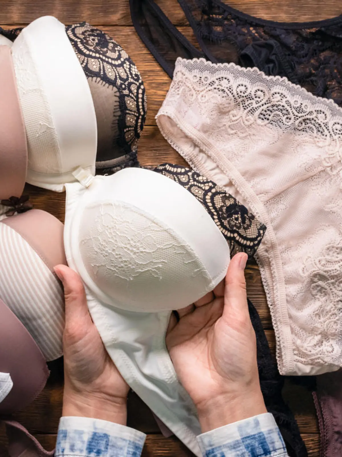 Woman is choosing a new underwear in a lingerie shop.