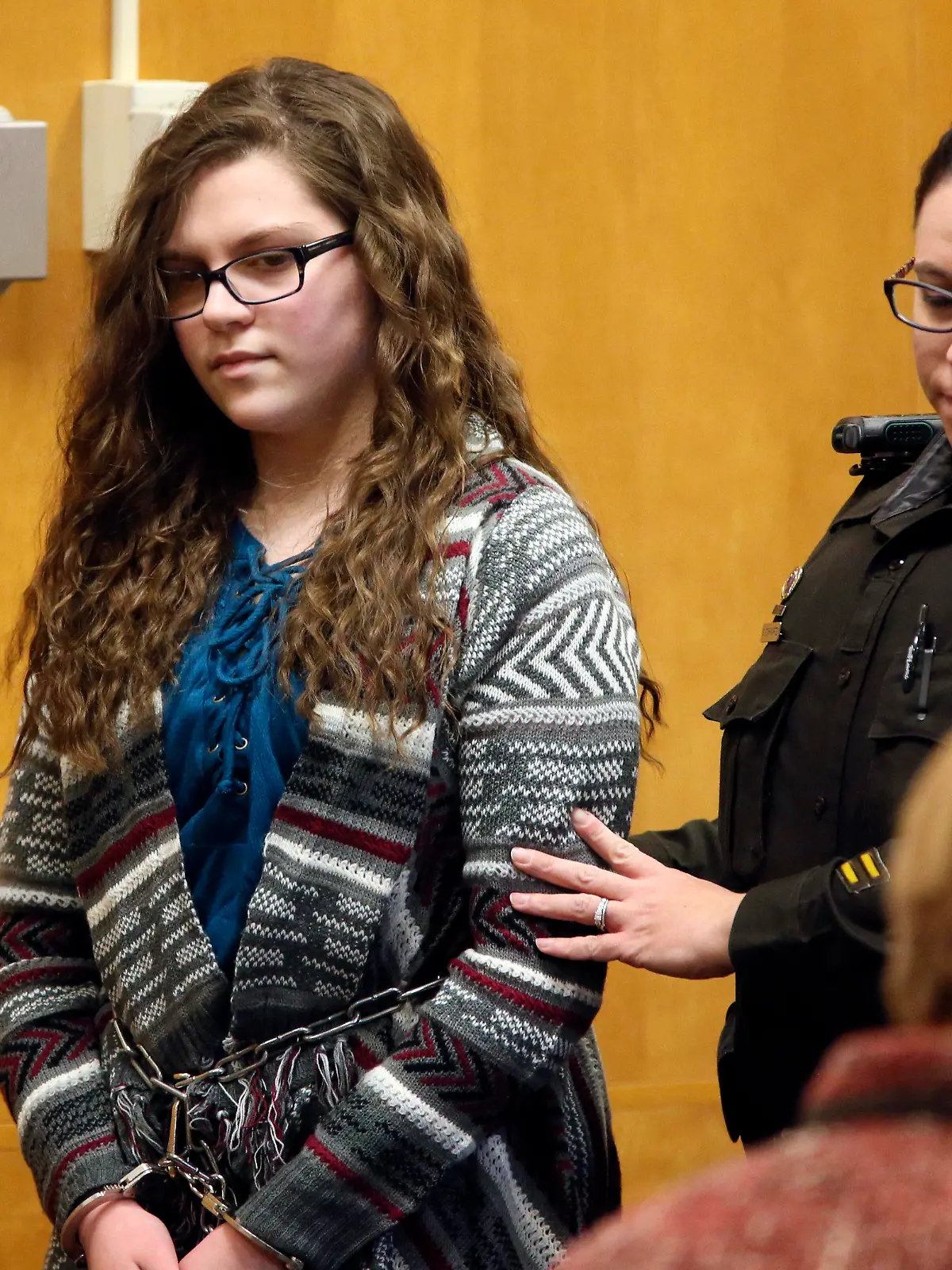 FILE - In this Thursday, Dec. 21, 2017 file photo, Anissa Weier, one of two Wisconsin girls who tried to kill a classmate to win favor with a fictional horror character named Slender Man, is led into the Waukesha County Court for her sentencing hearing, in Waukesha, Wis. On Friday, Sept. 10, 2021, a judge is set to review a release plan for Weier, who has spent four years in a mental health facility after she admitted to taking part in the 2014 stabbing. (Michael Sears/Milwaukee Journal-Sentinel via AP, File)/Milwaukee Journal-Sentinel via AP)