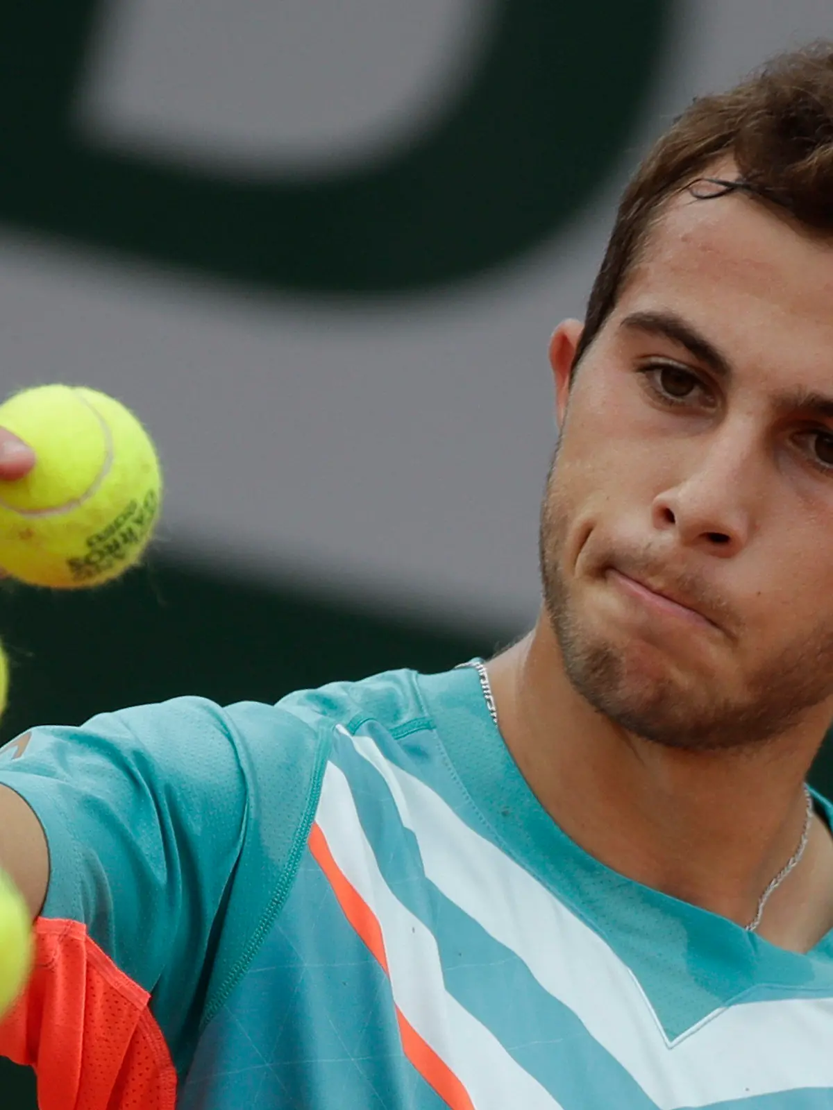 FILE - France's Hugo Gaston prepares to serve against Japan's Yoshihito Nishioka in the second round match of the French Open tennis tournament at the Roland Garros stadium in Paris, France, Wednesday, Sept. 30, 2020. On Monday, May 22, 2023, the ATP Tour announced Gaston was fined 144,000 euros (about $155,000) - more than he’s collected in prize money so far in 2023 - for pulling a ball out of his pocket and throwing it on the court during a point in an attempt to get a do-over, his fourth unsportsmanlike conduct violation this season. (AP Photo/Alessandra Tarantino, File)