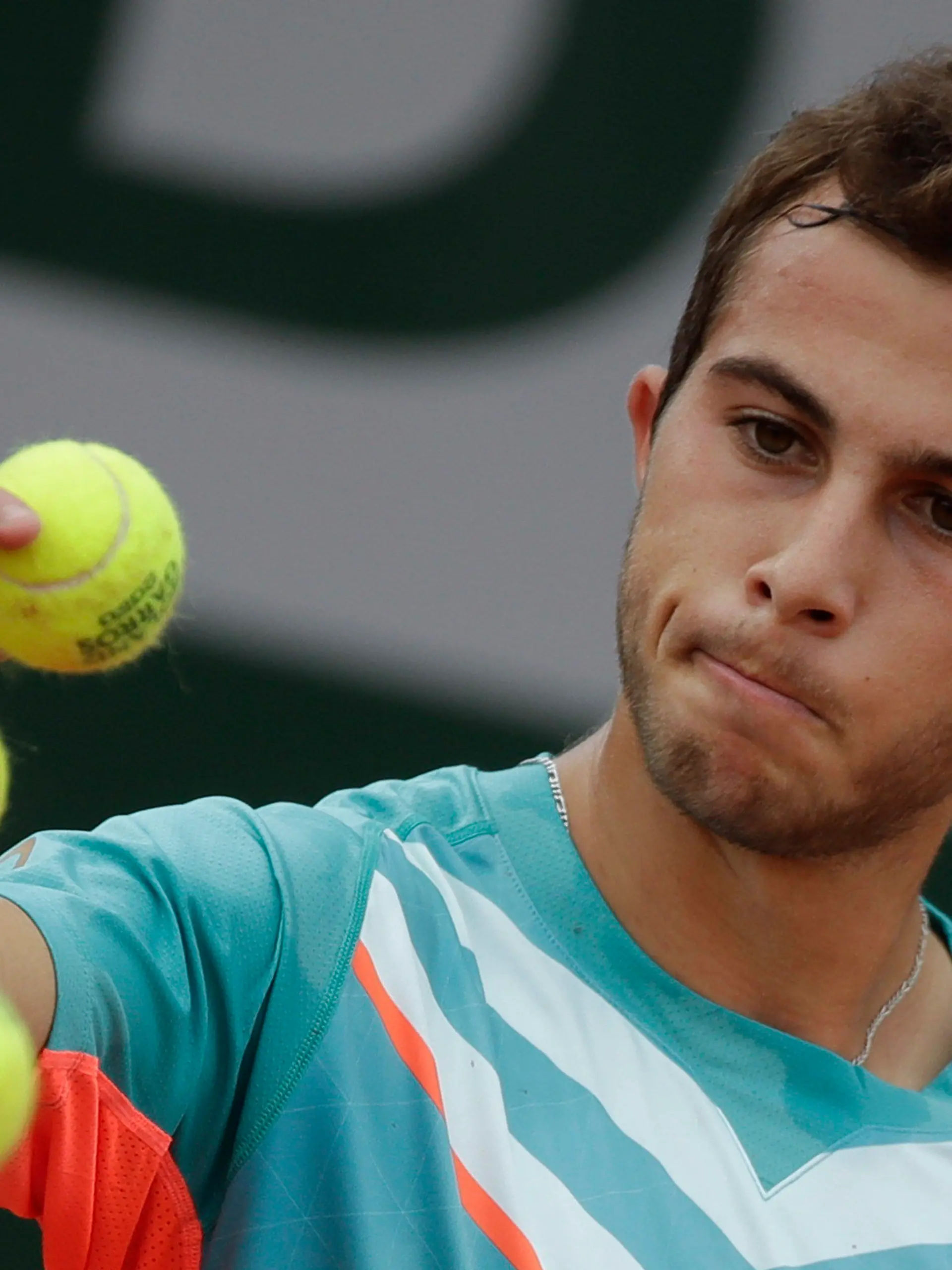 FILE - France's Hugo Gaston prepares to serve against Japan's Yoshihito Nishioka in the second round match of the French Open tennis tournament at the Roland Garros stadium in Paris, France, Wednesday, Sept. 30, 2020. On Monday, May 22, 2023, the ATP Tour announced Gaston was fined 144,000 euros (about $155,000) - more than he’s collected in prize money so far in 2023 - for pulling a ball out of his pocket and throwing it on the court during a point in an attempt to get a do-over, his fourth unsportsmanlike conduct violation this season. (AP Photo/Alessandra Tarantino, File)