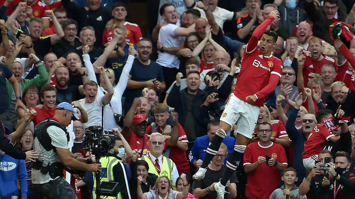 Manchester United's Cristiano Ronaldo celebrates after scoring his side's second goal during the English Premier League soccer match between Manchester United and Newcastle United at Old Trafford stadium in Manchester, England, Saturday, Sept. 11, 2021. (AP Photo/Rui Vieira)